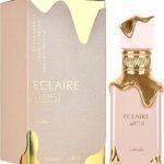 Perfume Lattafa Eclaire EDP 100 ml frasco beige con tapa dorada y letras en relieve